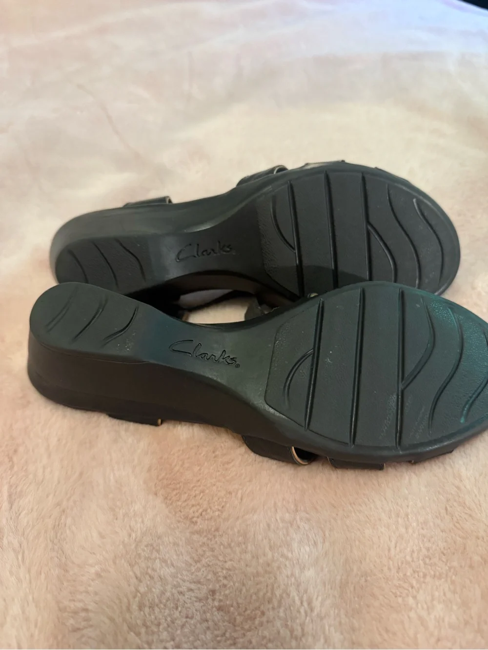 Clarks Black Leather Cutout Slingback Sandals with Gold Buckle